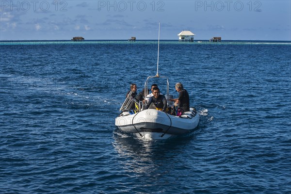 Divers in rubber boat