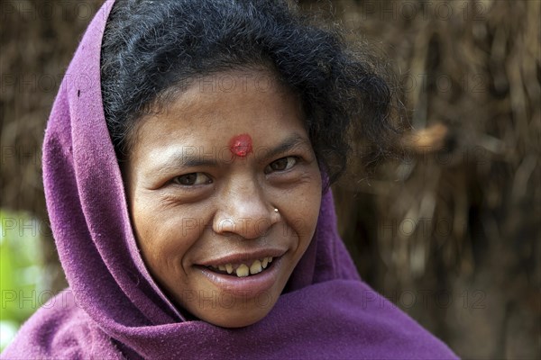 Nepalese woman with purple headscarf