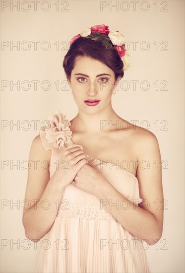 Beauty portrait of a young woman with flowers in her hair