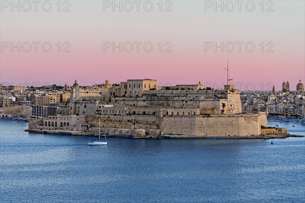 View from Valletta of the fortress Fort St. Angelo in the centre of the Grand Harbour