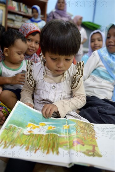 Girl looking at a picture book