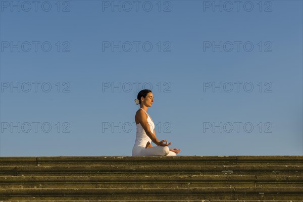 Young woman practising Hatha yoga