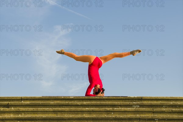 Young woman practising Hatha yoga