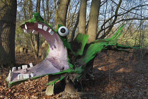 Green Dragon sculpture made from a painted tree root