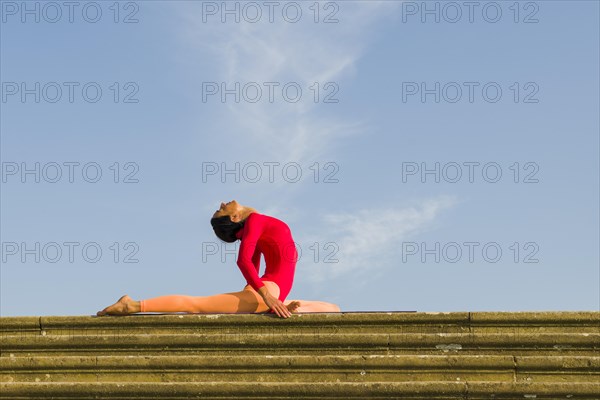 Young woman practising Hatha yoga