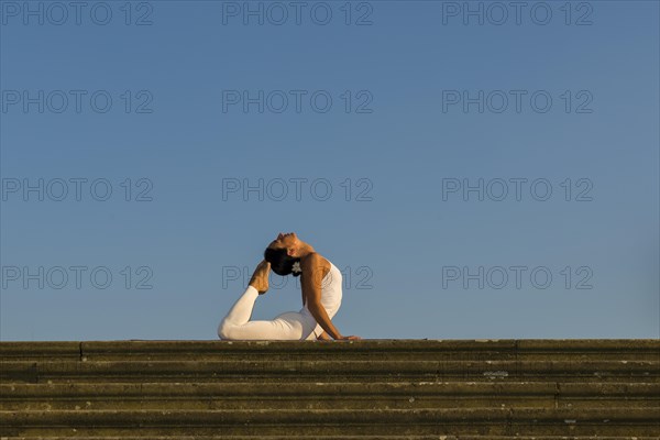 Young woman practising Hatha yoga