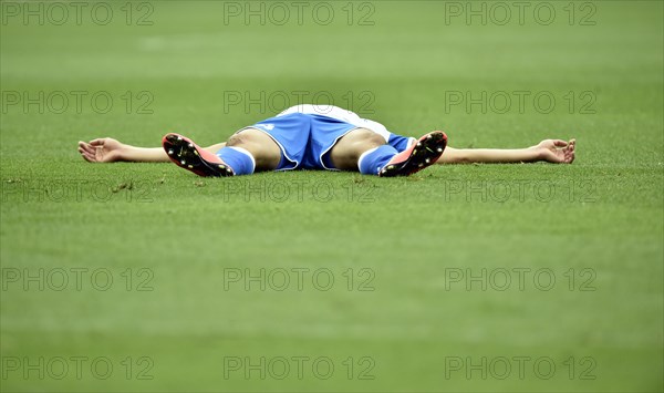 Injured football player lying on the ground