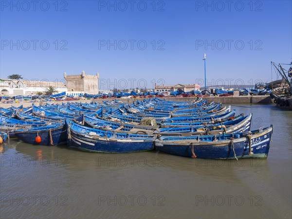 Old blue fishing boats in the port of Essaouira