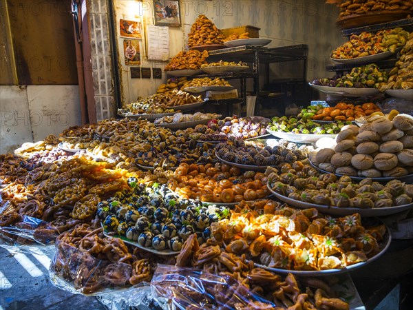 Spices and dried fruits for sale at a market stall