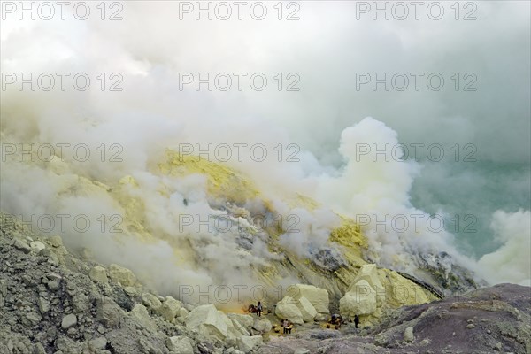 Workers mining sulphur at the Ijen volcano