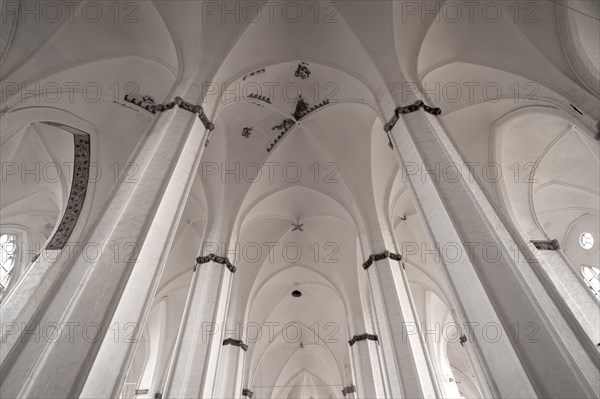 Whitewashed arches of the Gothic brick hall church of St. Peter's Church
