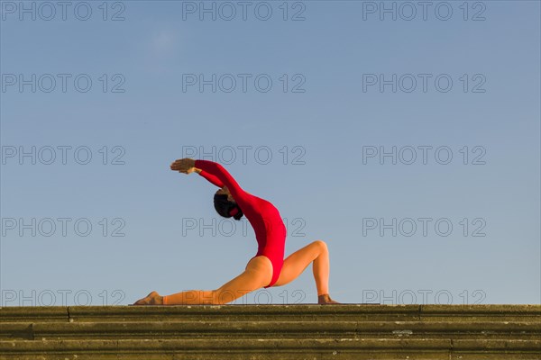 Young woman practising Hatha yoga