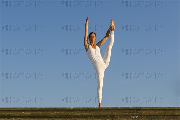 Young woman practising Hatha yoga