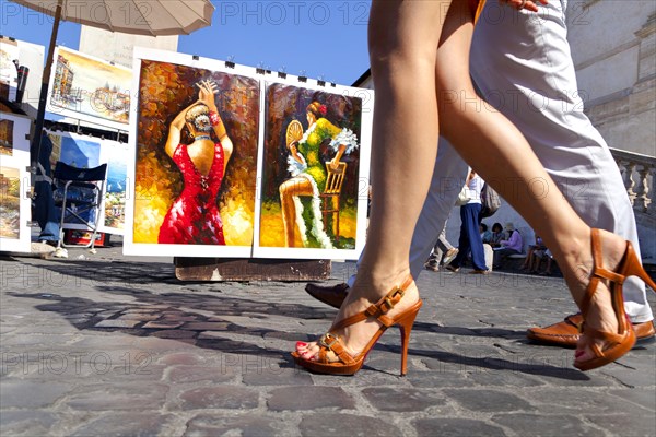 Legs of a couple walking in Piazza Trinita' dei Monti