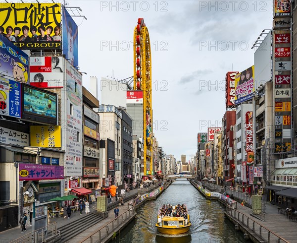 Tourist boat on the Dotonbori canal