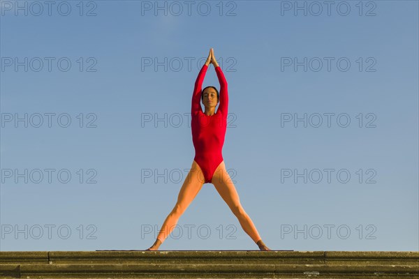 Young woman practising Hatha yoga