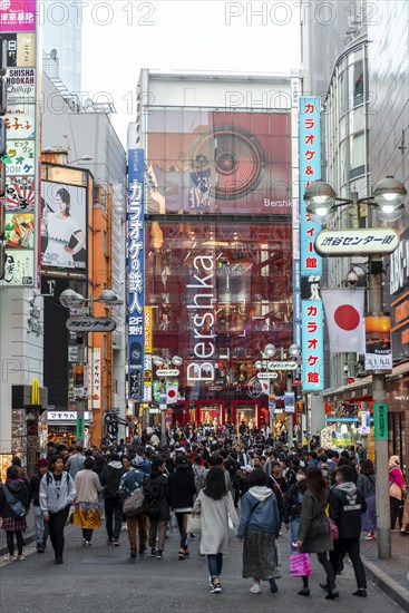 A busy street with many shopping centers and shops