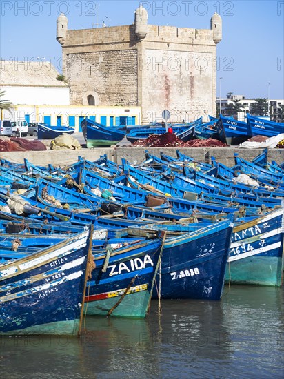 Old blue fishing boats in the port of Essaouira