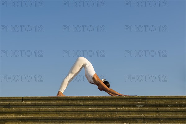 Young woman practising Hatha yoga