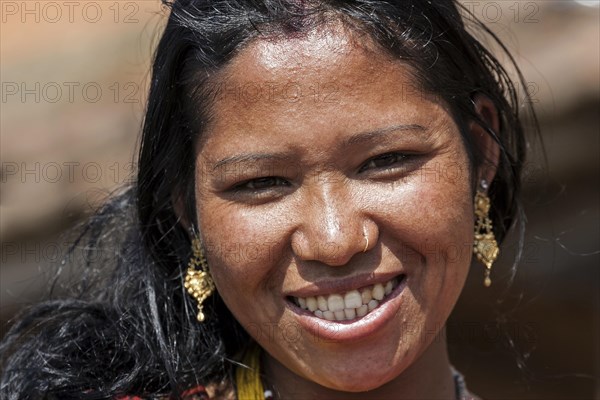 Nepalese woman with earrings and nose piercing