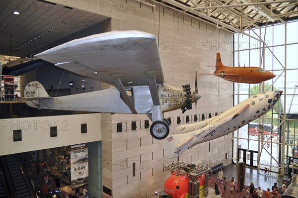 Spirit of St. Louis airplane and Space Ship One hanging from ceiling