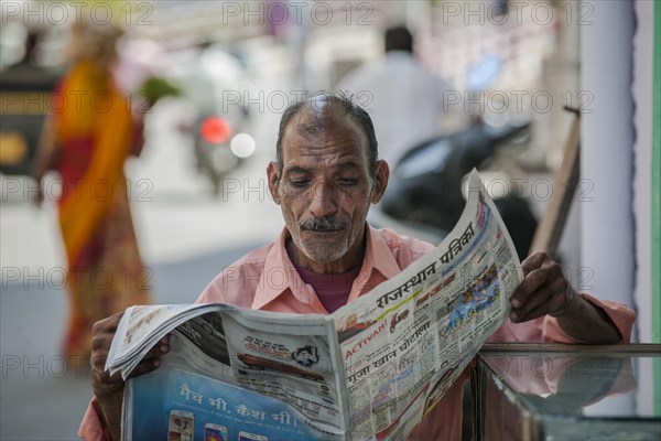 Man reading newspaper