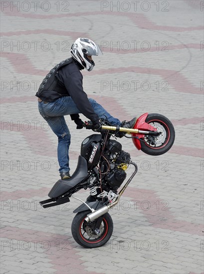 Motorcycle stunt rider performing