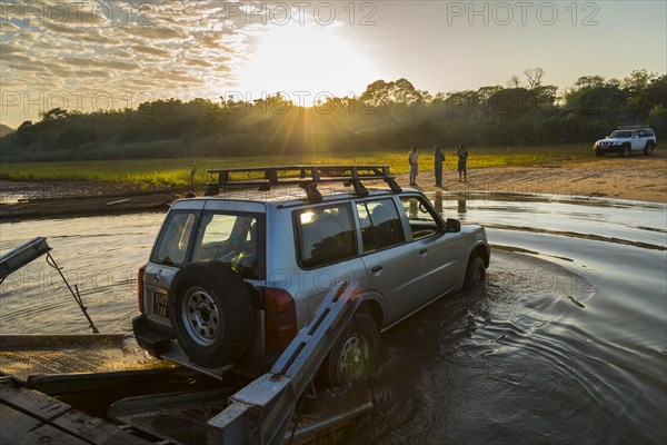 Off-road vehicle driving off the ferry on the Manambolo river