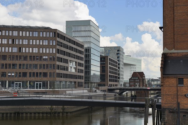 Modern office buildings at Brooktorhafen harbour with Museumsbruecke bridge