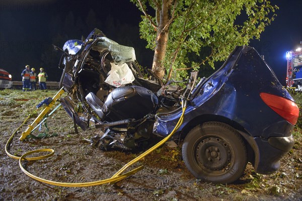 The wreckage of a Peugeot after fatally crashing into a tree