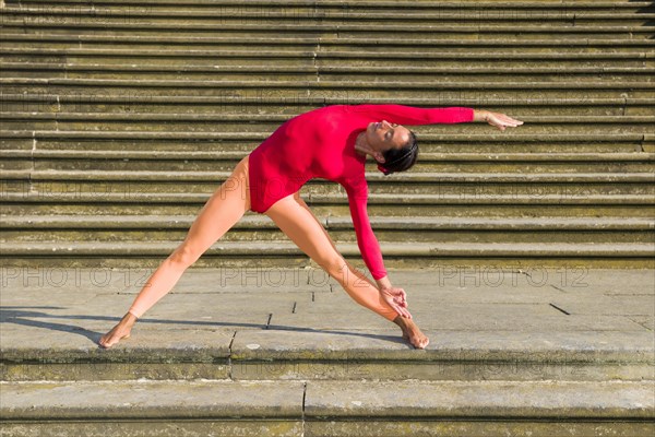 Young woman practising Hatha-Yoga outdoors