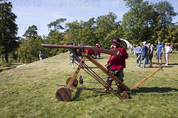 Soldier with a large muzzle-loading gun during live role-playing or ReenLarpment