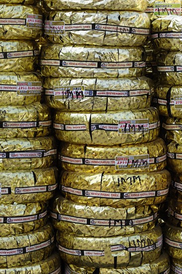 Kenda off-road tyres wrapped in gold foil