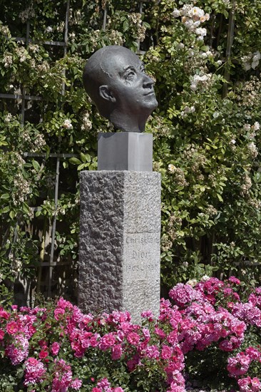 Rose garden with a statue of Christian Dior