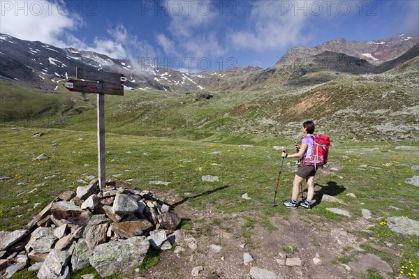 Hikers climbing Gleckspitz mountain in the rearmost Ultental valley