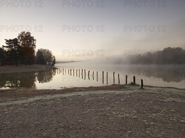 Early morning mood at Kuhsee lake with a bathing bay