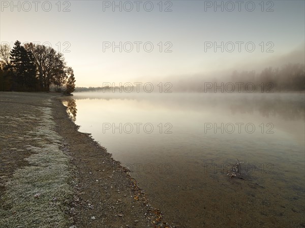 Early morning mood at Kuhsee lake with fog