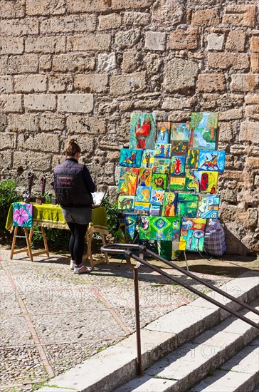 Street vendor selling paintings