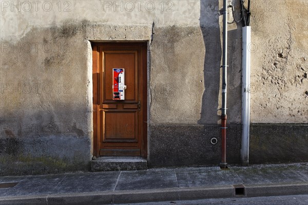 Condom vending machine on the door of a house