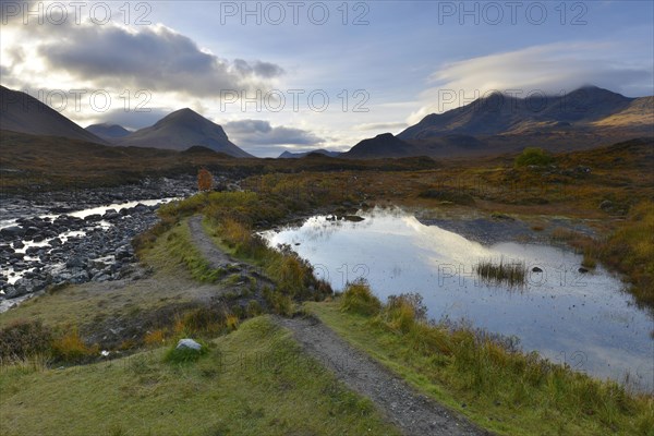 Small lake in front of the Black Cullins Mountains