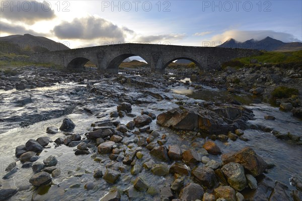 Old stone bridge in front of the Black Cullins Mountains