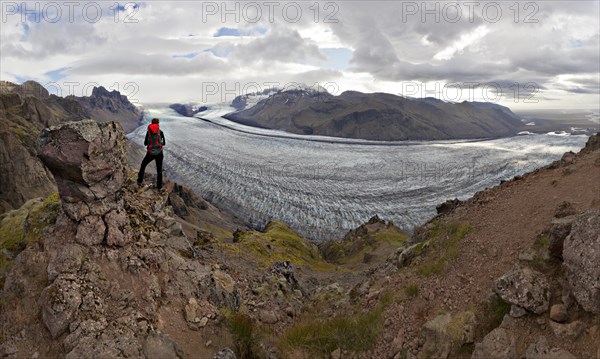 Mountaineer in front of Vatnajoekull glacier tongue