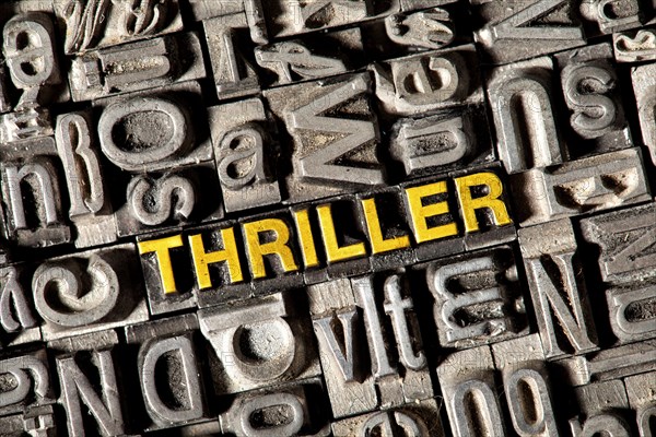 Old lead letters forming the word 'THRILLER'