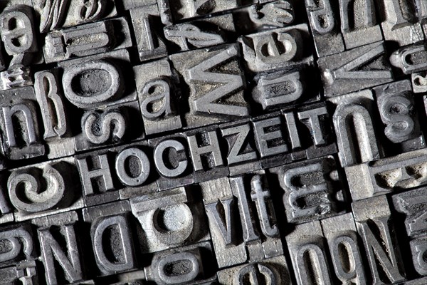 Old lead letters forming the word HOCHZEIT