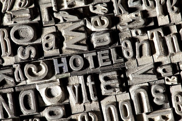 Old lead letters forming the word HOTEL