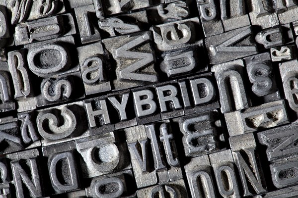 Old lead letters forming the word HYBRID