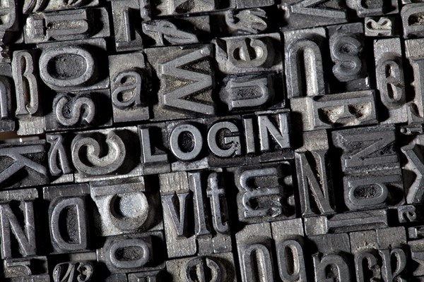 Old lead letters forming the word "LOGIN"