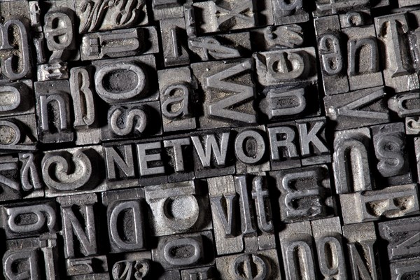 Old lead letters forming the word 'NETWORK'
