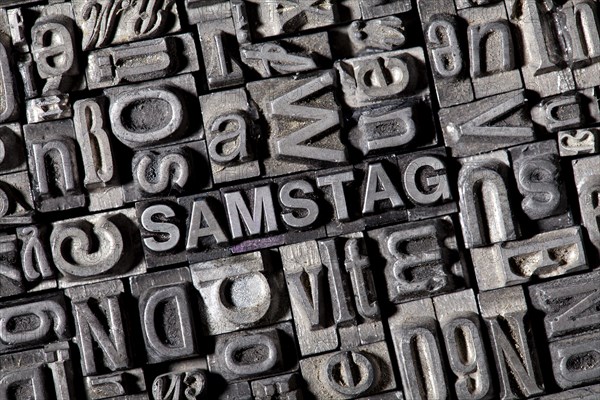 Old lead letters forming the word SAMSTAG