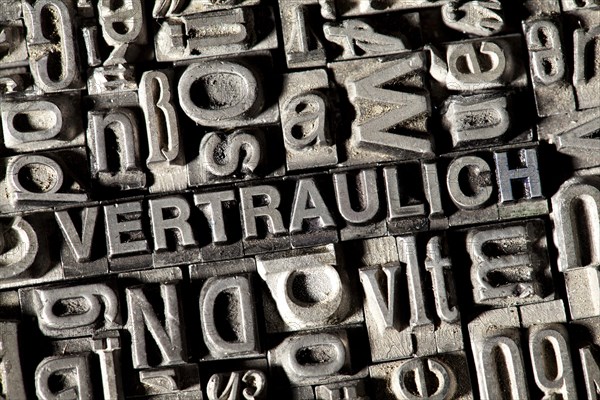 Old lead letters forming the word VERTRAULICH